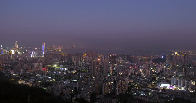 city landscape of Shenzhen Guangdong south China,brilliant lights on buildings,shenzhen bay bridge in distance   
