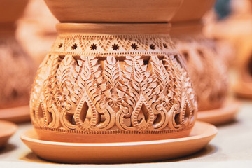 Thai art engrave pattern on the traditional pottery