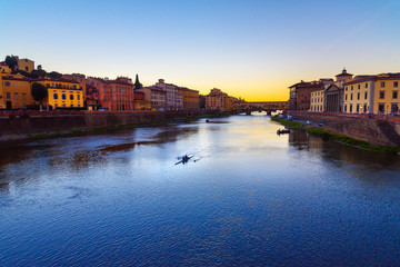 Naklejka premium Ponte Vecchio Bridge over river Arno at sunset. Florence. Italy