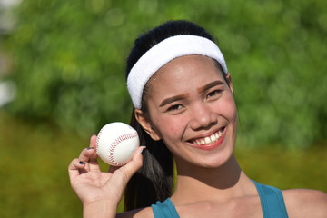 Smiling Athletic Asian Female Baseball Player With Baseball