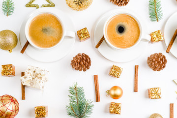 Creative natural layout of Christmas decorations with cups of coffee on a white background. Flat lay, Top view