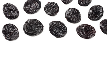 Dried plums - prunes isolated on white background. top view