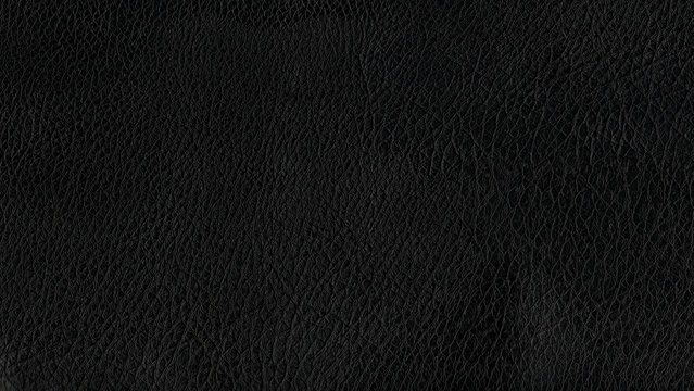 Deep dark black color luxury genuine cow leather texture background. Close up photography of sofa, chair, interior, auto seat cover