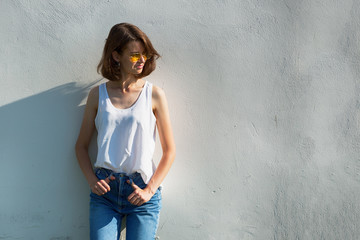 Portrait of a teenage girl in yellow glasses. Copy space.
