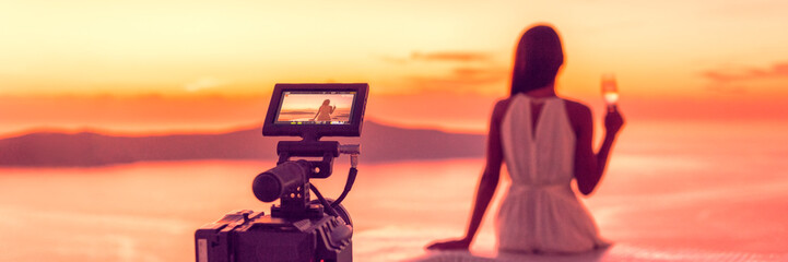 Videography professional video camera shoot behind the scene shooting at hotel filming sunset scene banner panorama, luxury travel. Professional videography equipment shooting in summer destination.