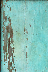 Old Wood door paint green color peeling texture background with copy space