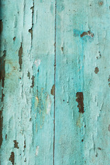 Old Wood door paint green color peeling texture background with copy space