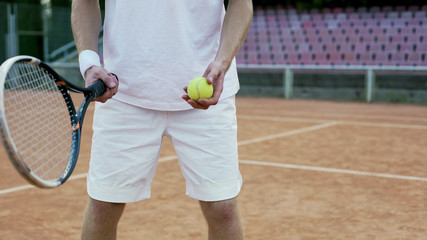 Experienced tennis player serving ball to opponent, racket sport and hobby