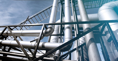Industrial zone, Steel pipelines and valves against blue sky