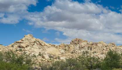 Fototapeta na wymiar Rocky ridge with cloudy skies Joshua Tree Park