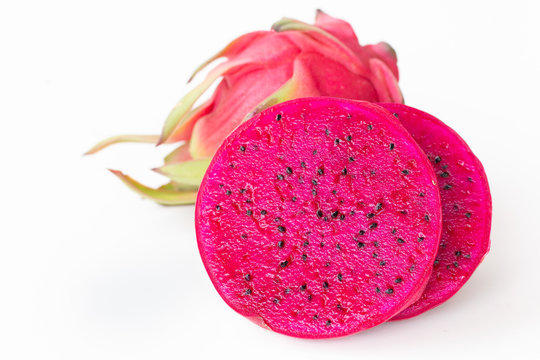 Fresh pitahaya fruit sliced on white background or ripe dragon fruit red color with copy-space design for drinks package design, healthy article picture and plantation guide book design
