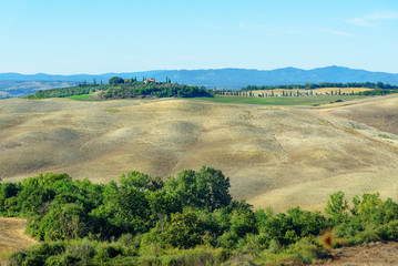 Fototapeta na wymiar View of beautiful landscape of hills and fields near Asciano. Tuscany, Italy