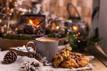 Fragrant hot coffee and chocolate cookies for Santa Claus. A drink for the holiday and a cozy Christmas atmosphere. Free space for text.
