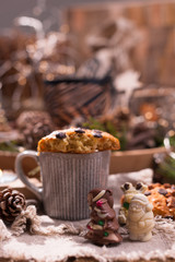 Fragrant coffee, chocolates in the form of Christmas figures. Cookies and hot drink for the holiday. Cozy atmosphere, candles decor. free space for text.