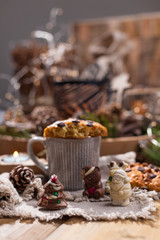 Fragrant coffee, chocolates in the form of Christmas figures. Cookies and hot drink for the holiday. Cozy atmosphere, candles decor. free space for text.