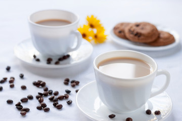 Breakfast for two with coffee and oatmeal cookies.