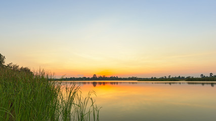 Fototapeta na wymiar Landscape of calm lake at sunset