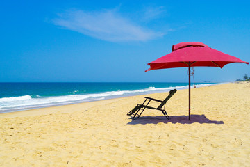 beach umbrella and chair on beach