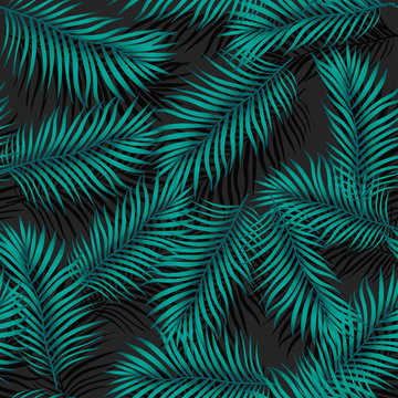 Vector trendy, fashionable seamless pattern. Big green exotic tropical palm leaves of banana or coconut trees on a black background