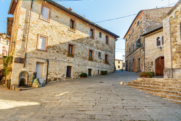 Fototapeta na wymiar On the street in old medieval village Castellina in Chianti. Italy