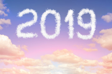 Naklejka na ściany i meble Dramatic sunset or sunrise cloudscape with 2019 text. Christmas and new year celebration concept