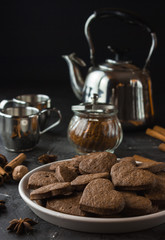 Vegan heart gingerbread cookies on dark background