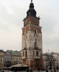 Below view of the high Catholic chapel in the center of the city against the background of the cloudy winter sky.