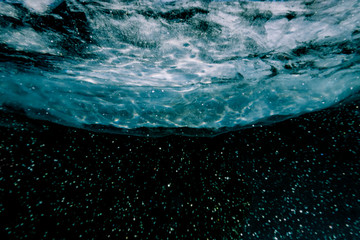 underwater world in the turquoise depth of water and ice