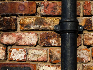 brick wall with pipe