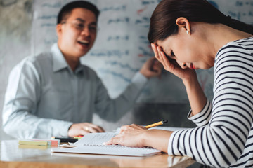 High school or college student group catching up workbook and learning tutoring in classroom and reading, doing homework and lesson practice preparing exam to entrance, education concept