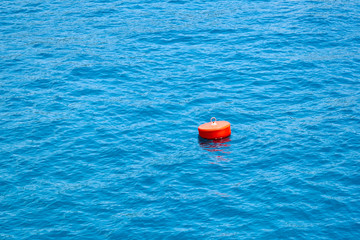 Buoy on the sea. A buoy is a floating device that can have many purposes.