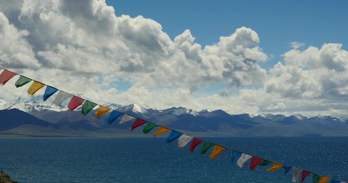 4k Prayer flags at the lake namtso in tibet,ancient holy monk meditation in cave,ZhaXi Peninsula,tibet mansarovar,Tibet's second largest lake,is the third largest saltwater lake in China.
