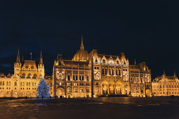 Fototapeta na wymiar Budapest Parliament at night illuminated at Christmas