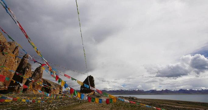 4k Prayer flags at the lake namtso in tibet,ancient holy monk meditation in cave,ZhaXi Peninsula,tibet mansarovar,Tibet's second largest lake,is the third largest saltwater lake in China.