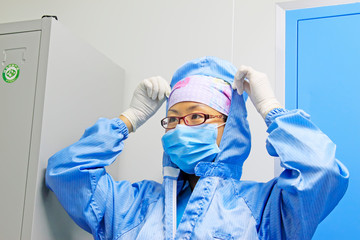 Fototapeta na wymiar a doctor finishing clothing, China