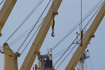 The hook hangs on a sturdy cable from the port cranes.