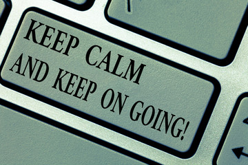 Writing note showing Keep Calm And Keep On Going. Business photo showcasing Get relaxed and continue moving taking action Keyboard key Intention to create computer message pressing keypad idea