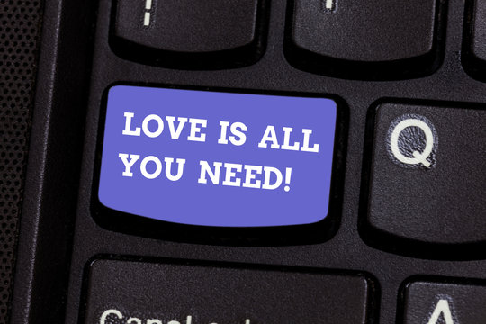 Writing note showing Love Is All You Need. Business photo showcasing Inspiration roanalysistic feelings needed motivation Keyboard key Intention to create computer message pressing keypad idea