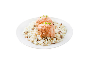 Chicken meatballs in creamy tomato sauce with rice isolated on white background with clipping path