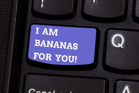 Writing note showing I Am Bananas For You. Business photo showcasing To be crazy for someone in loved happy emotion Keyboard key Intention to create computer message pressing keypad idea