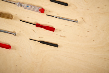 pattern background of various screwdrivers on  wooden work table