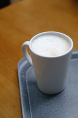 cup of coffee on wooden table