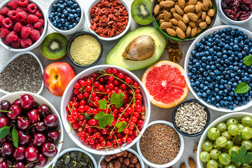 Healthy food on table, flat lay. Super foods for breakfast in a bowls with organic products, vegan diet for wellbeing