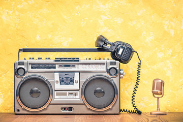 Retro outdated portable stereo boombox radio cassette recorder from circa late 70s, golden...