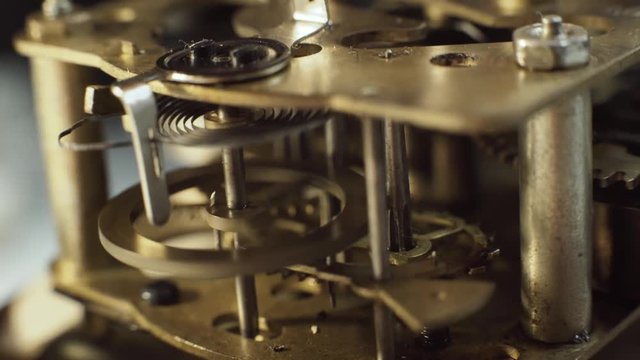 Closeup of gears and cogs clockwork and clock springs. Inside mechanism, clockwork with working gears