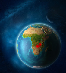 Zambia from space on planet Earth in space with Moon and Milky Way. Extremely fine detail of planet surface.