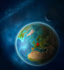 Germany from space on planet Earth in space with Moon and Milky Way. Extremely fine detail of planet surface.
