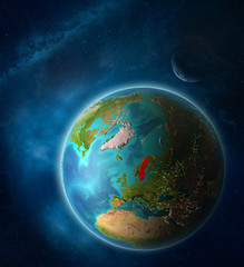 Sweden from space on planet Earth in space with Moon and Milky Way. Extremely fine detail of planet surface.