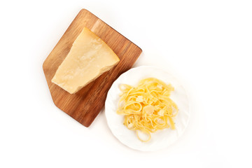 A photo of a plate of Italian pasta with Parmesan cheese, shot from the top on a white background with a place for text