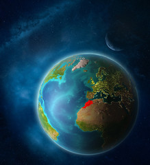 Morocco from space on planet Earth in space with Moon and Milky Way. Extremely fine detail of planet surface.